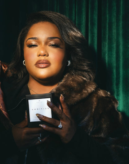 Woman holding a candle box with a dark background